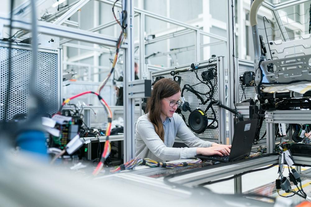 An engineer working at industrial equipment